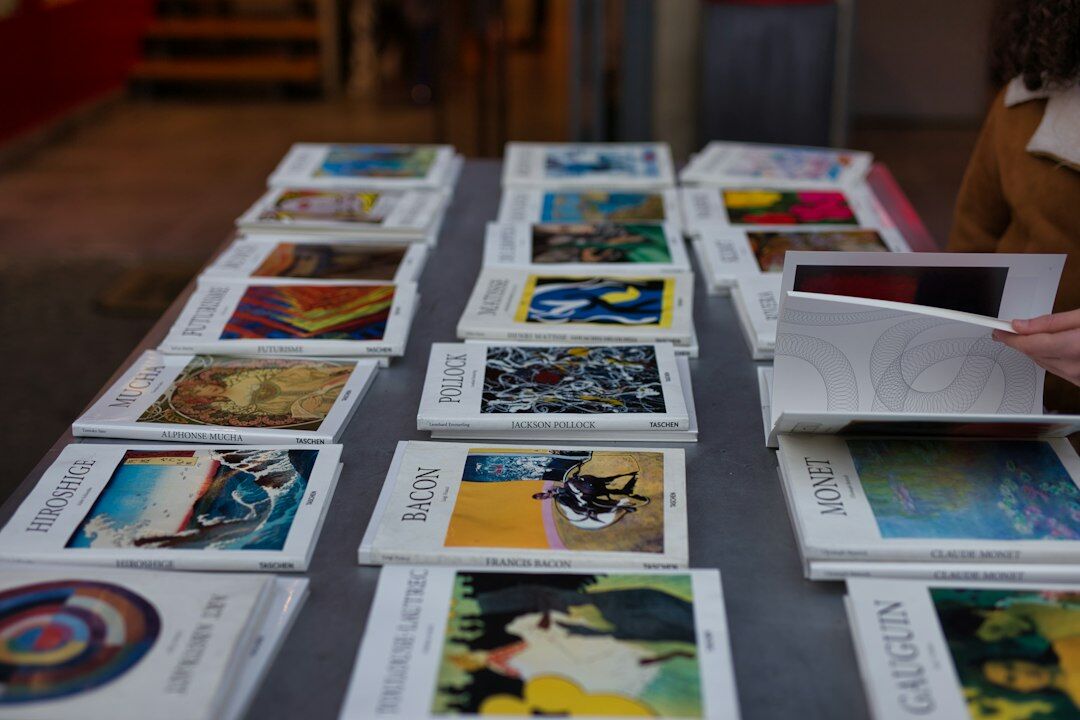 Editorial team reviewing printed magazine layouts on a large table