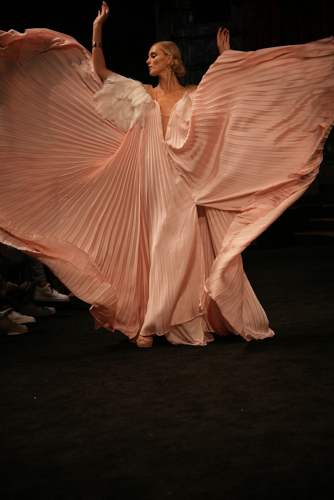 Close-up detail of a couture garment on a runway